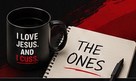 Black I Love Jesus mug beside a notebook that reads The Ones